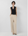 Beige pleated trousers with black pinstripes | Roberto Verino