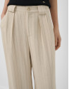 Beige pleated trousers with black pinstripes | Roberto Verino