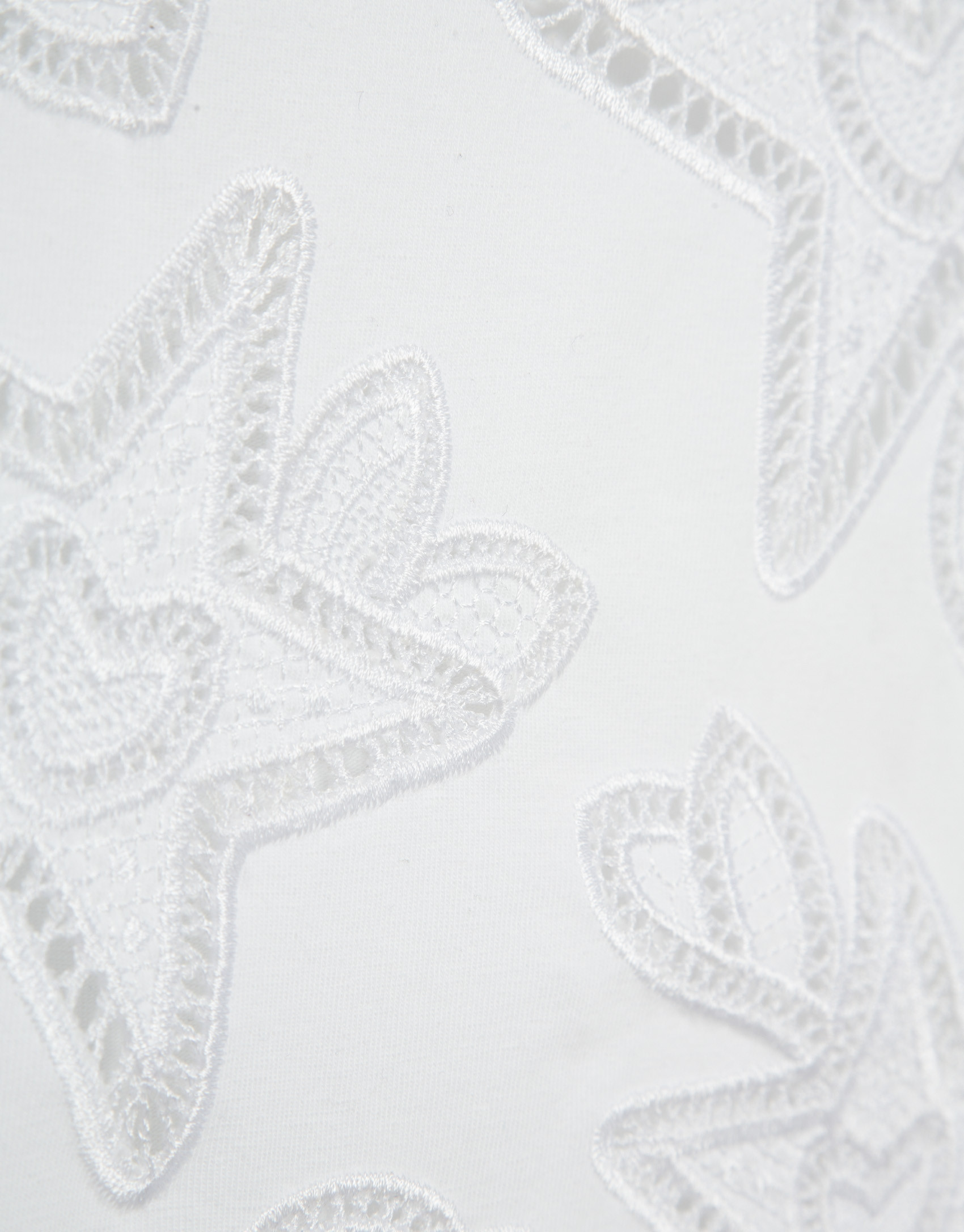 Oversized white sleeveless T-shirt with stars... | Roberto Verino