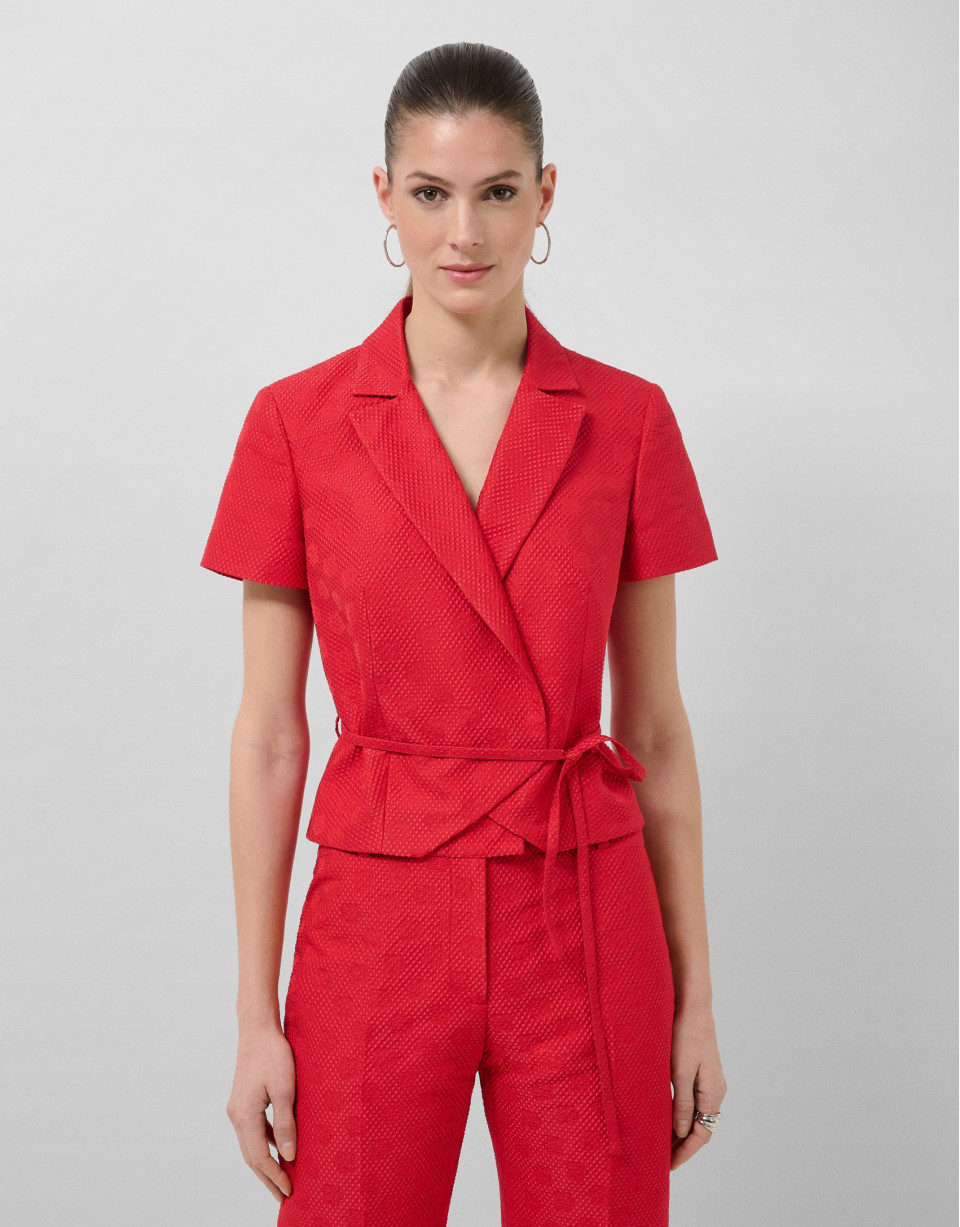 Short sleeveless jacket in red floral piqué ... | Roberto Verino