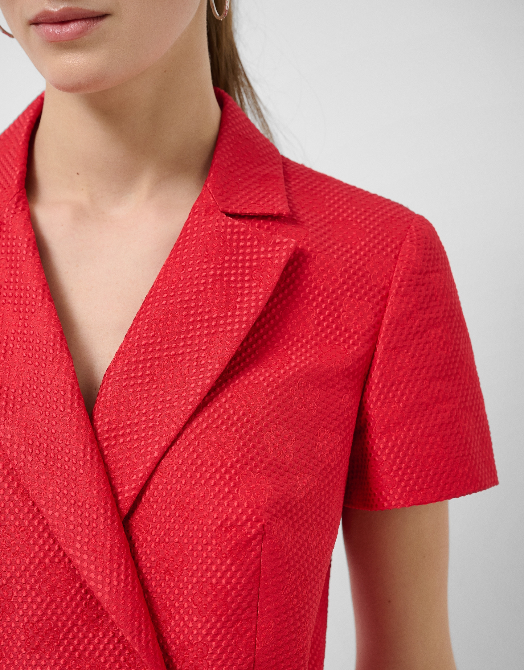 Short sleeveless jacket in red floral piqué ... | Roberto Verino