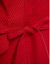Short sleeveless jacket in red floral piqué ... | Roberto Verino