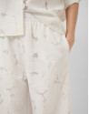 White devoré palazzo trousers with floral print | Roberto Verino