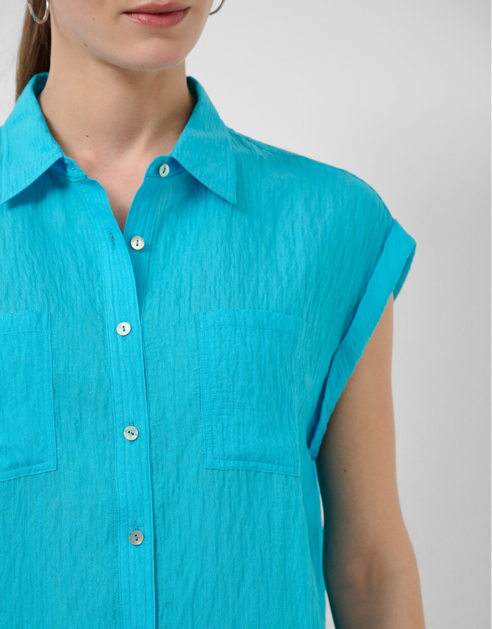 Turquoise sleeveless blouse with pockets | Roberto Verino