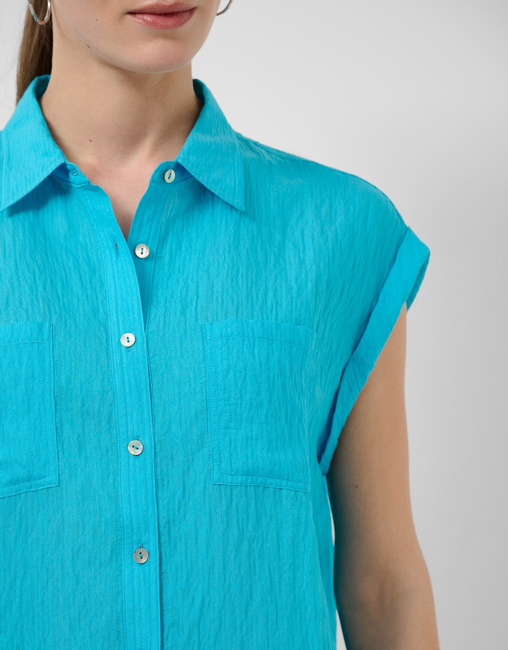 Turquoise sleeveless blouse with pockets | Roberto Verino
