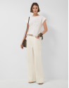 Oversized white sleeveless T-shirt with stars... | Roberto Verino