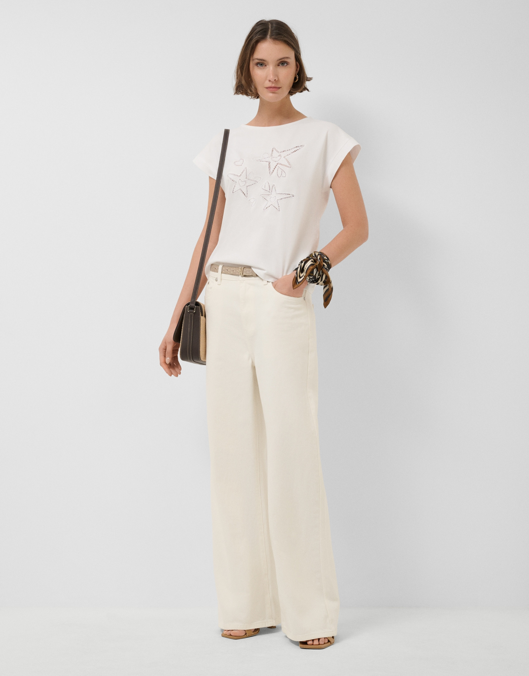 Oversized white sleeveless T-shirt with stars... | Roberto Verino