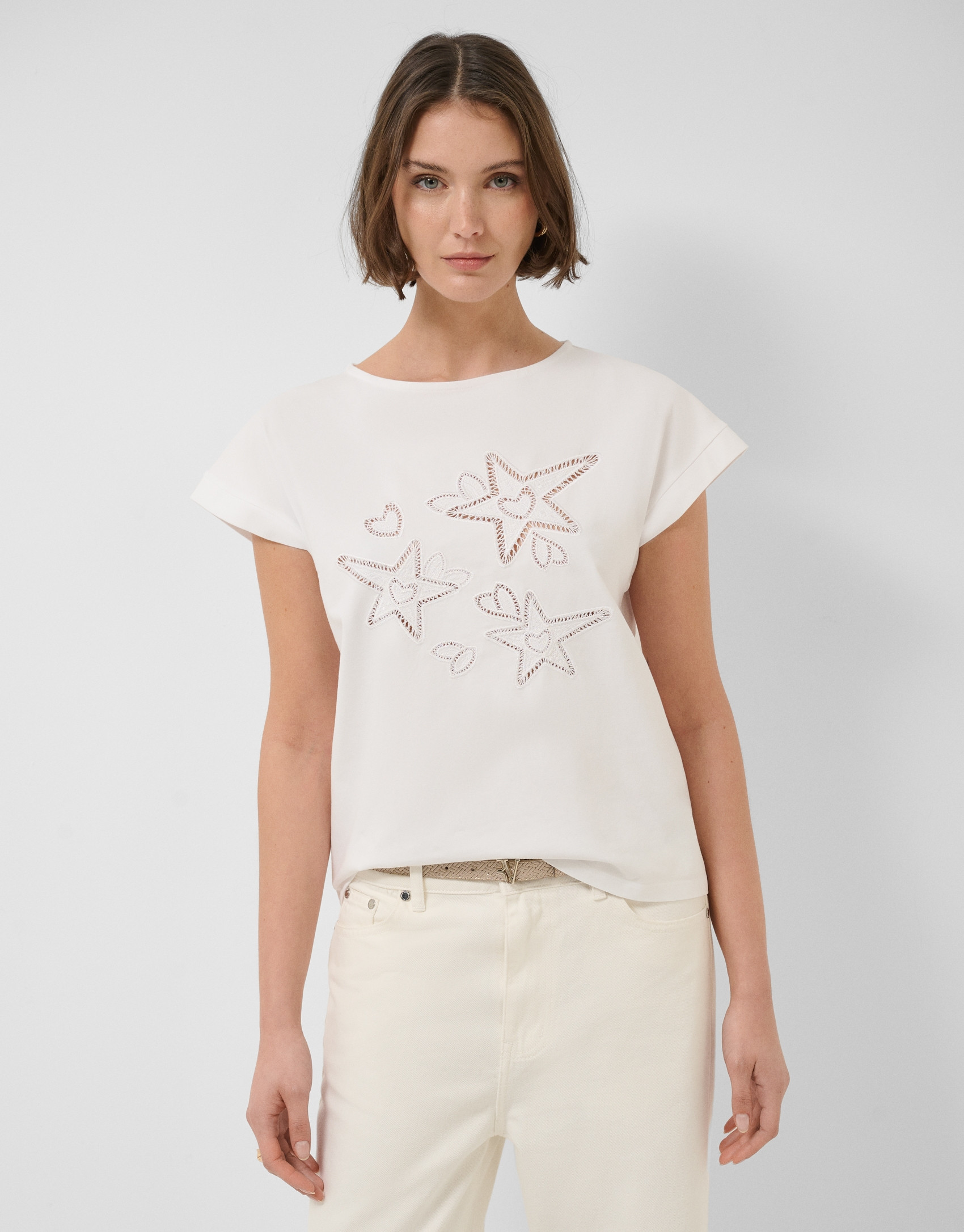 Oversized white sleeveless T-shirt with stars... | Roberto Verino