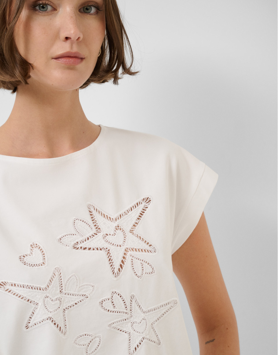 Oversized white sleeveless T-shirt with stars... | Roberto Verino