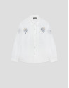 White shirt with blue embroidery on the ... | Roberto Verino