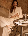 Wide-leg trousers with pleats in off-white ... | Roberto Verino