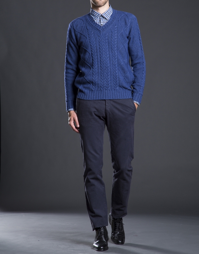 Blue V-neck sweater with cable stitch design 