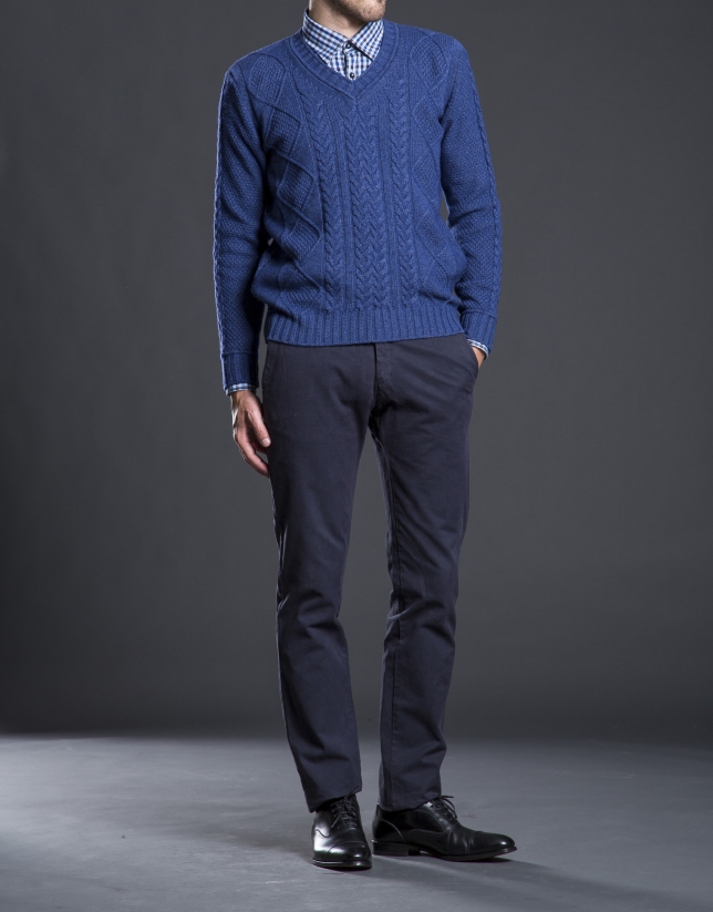 Blue V-neck sweater with cable stitch design 