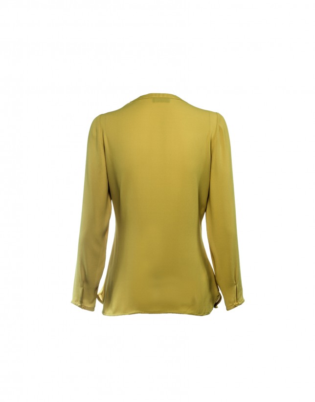 Long sleeved pale yellow blouse