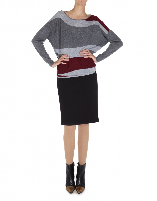 Gray and red dolman sleeve sweater.