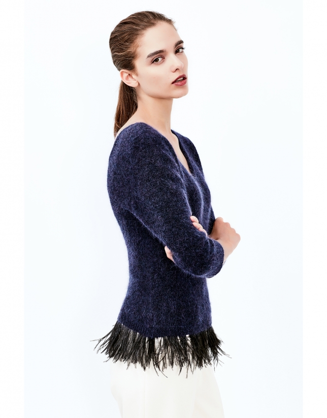 Blue sweater with feathers