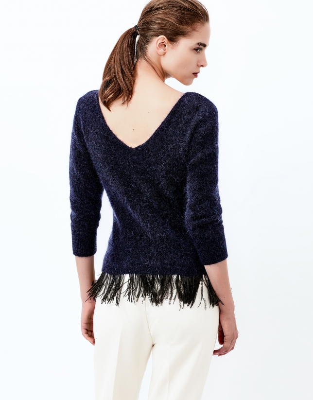 Blue sweater with feathers