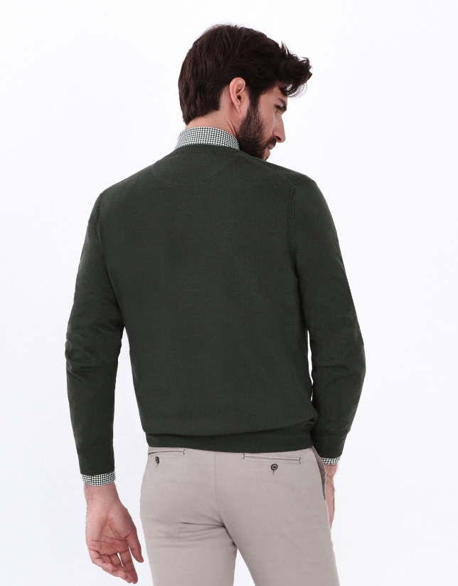 Green V-neck sweater
