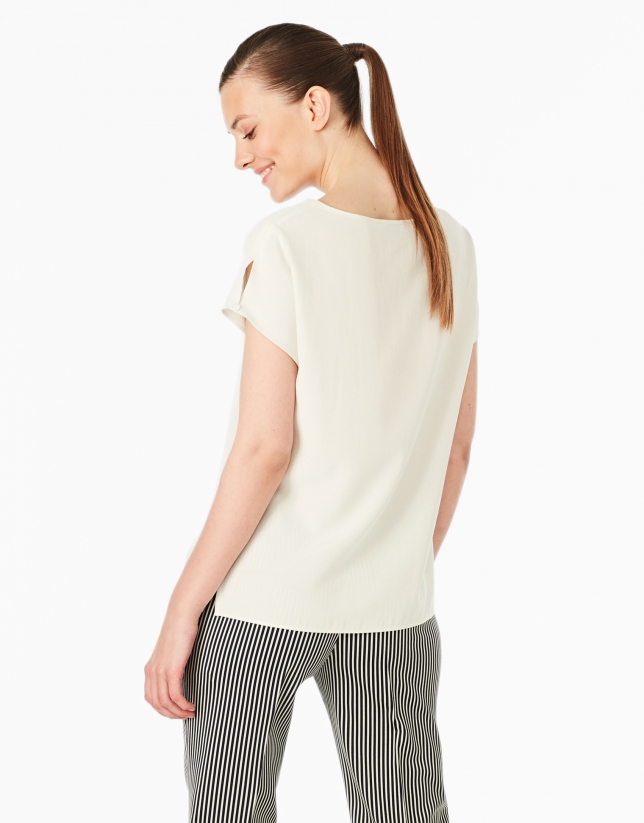 Cream-colored top with pocket