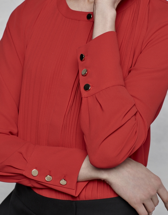 Red blouse with tucks
