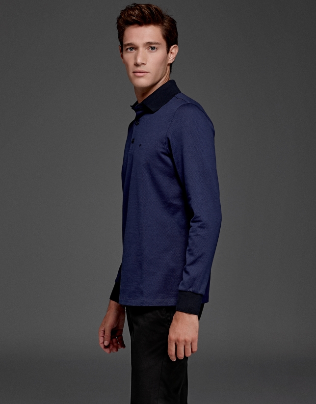 Blue short sleeved polo with navy blue design