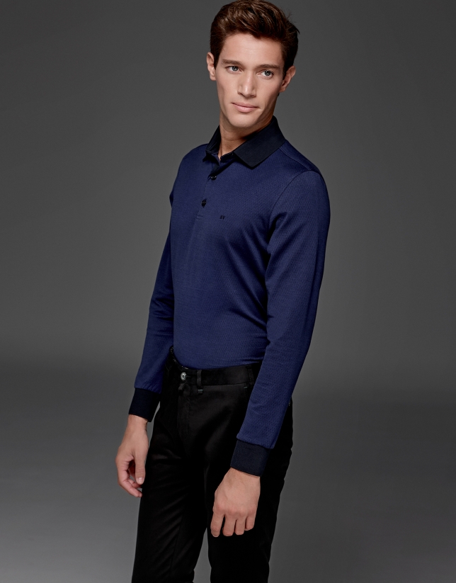 Blue short sleeved polo with navy blue design