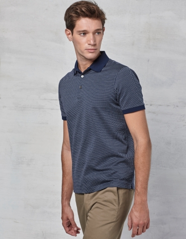 Navy blue short sleeved polo with white design
