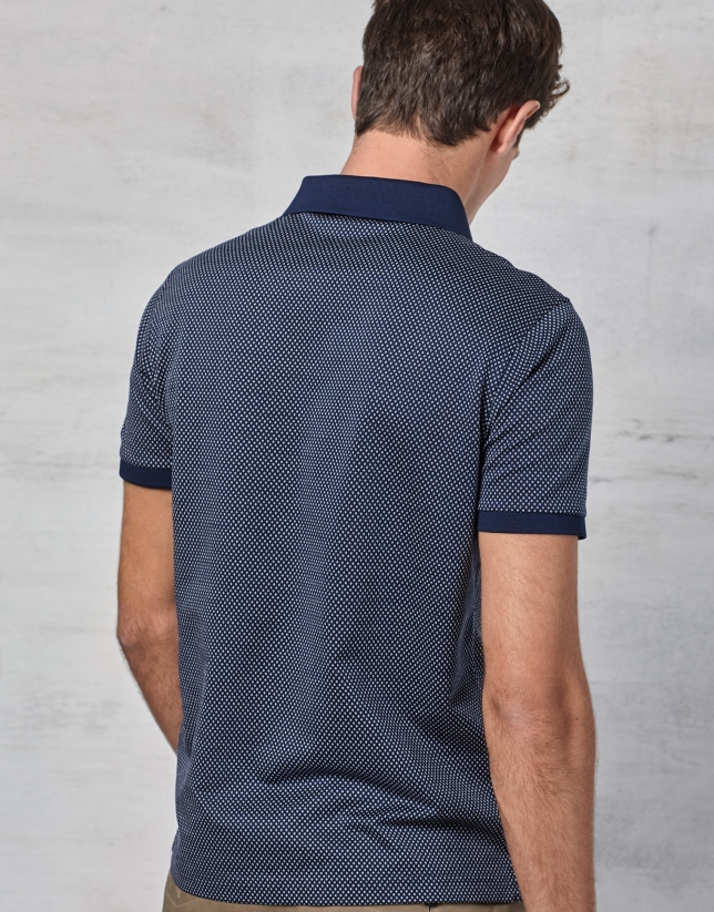 Navy blue short sleeved polo with white design