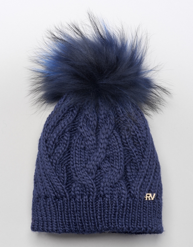 Blue cable knit wool cap with pompom