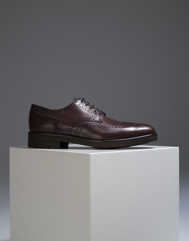 Brown classic shoe with perforations