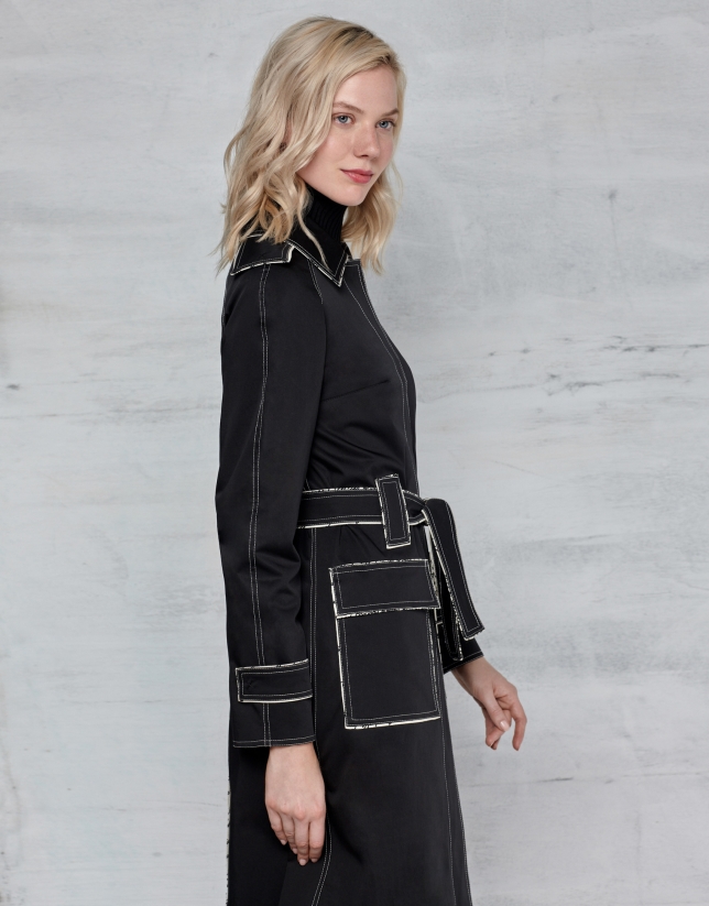 Black trench coat with white stitching