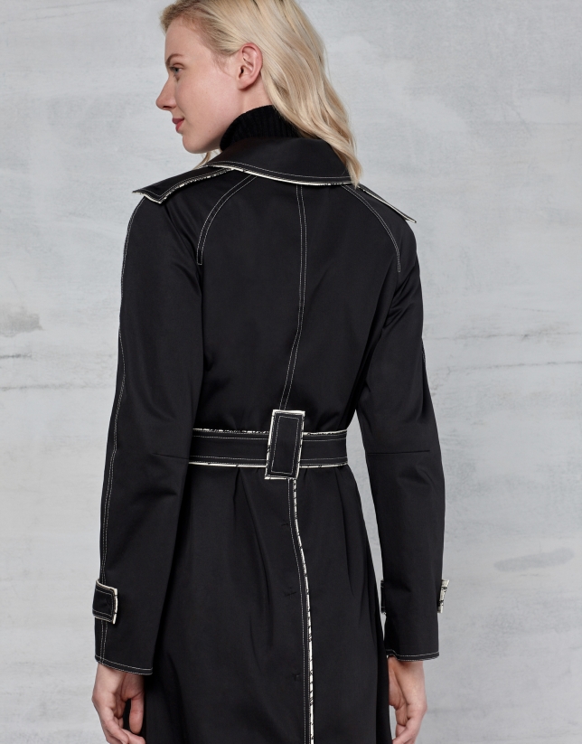 Black trench coat with white stitching
