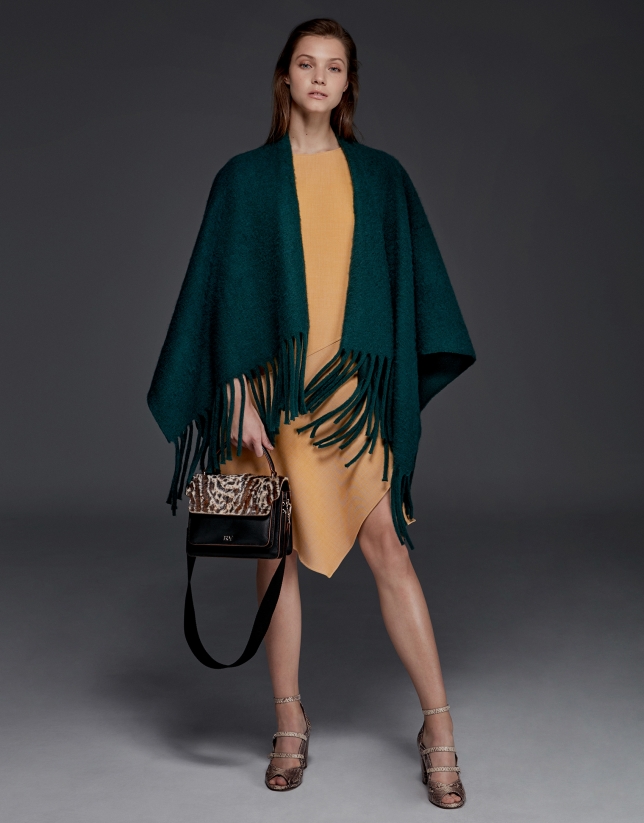 Green poncho with fringe