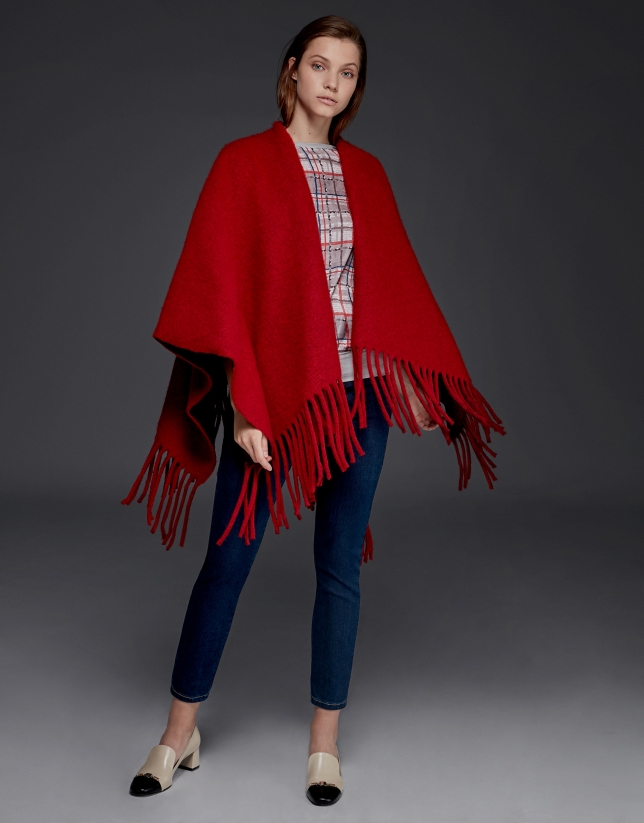 Red poncho with fringe