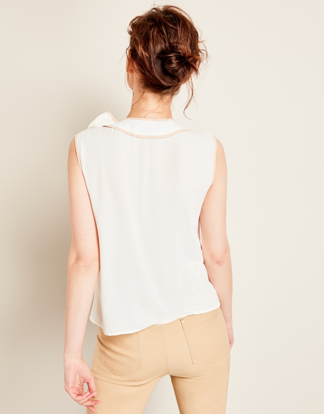 Beige top with bow