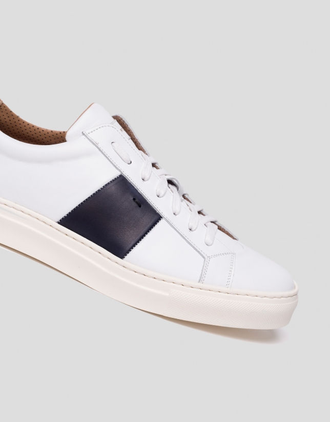 White sports shoes with side panels