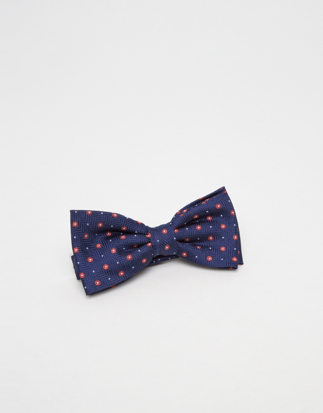 Navy blue jacquard bowtie with red polka dots