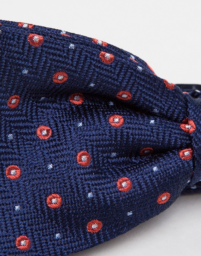 Navy blue jacquard bowtie with red polka dots
