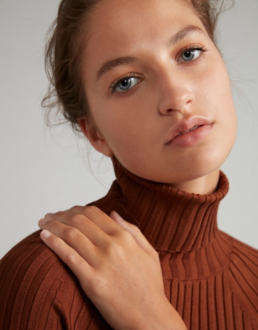 Mink-colored ribbed sweater with turtle neck