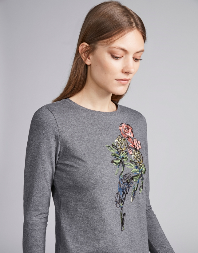 Steel-colored top with floral embroidered print