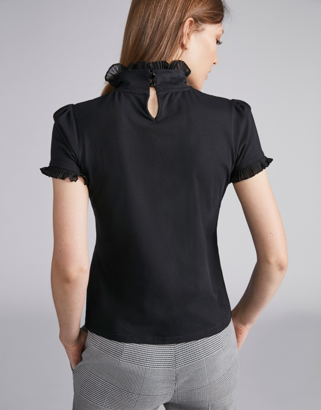Black short-sleeved top with stovepipe collar