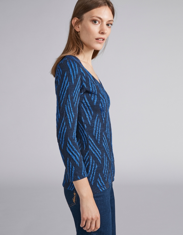 Blue and navy blue knit top with design