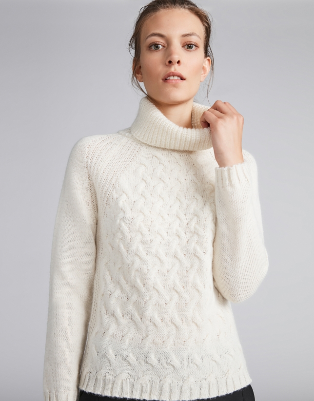 White sweater with stovepipe collar and decoration