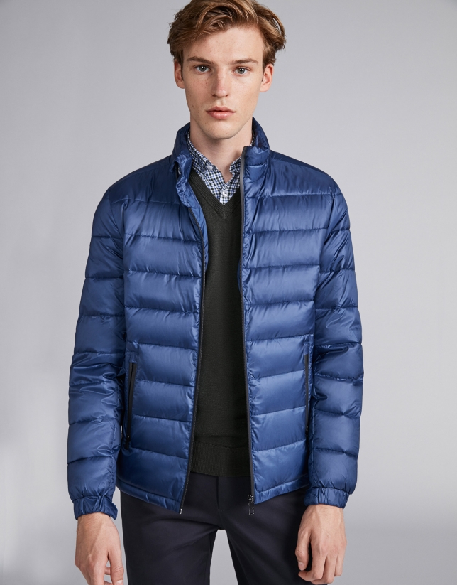 Blue tech ski jacket with details on zippers