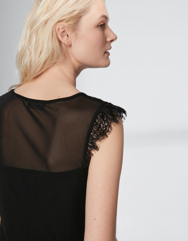 Black top with transparencies and lace