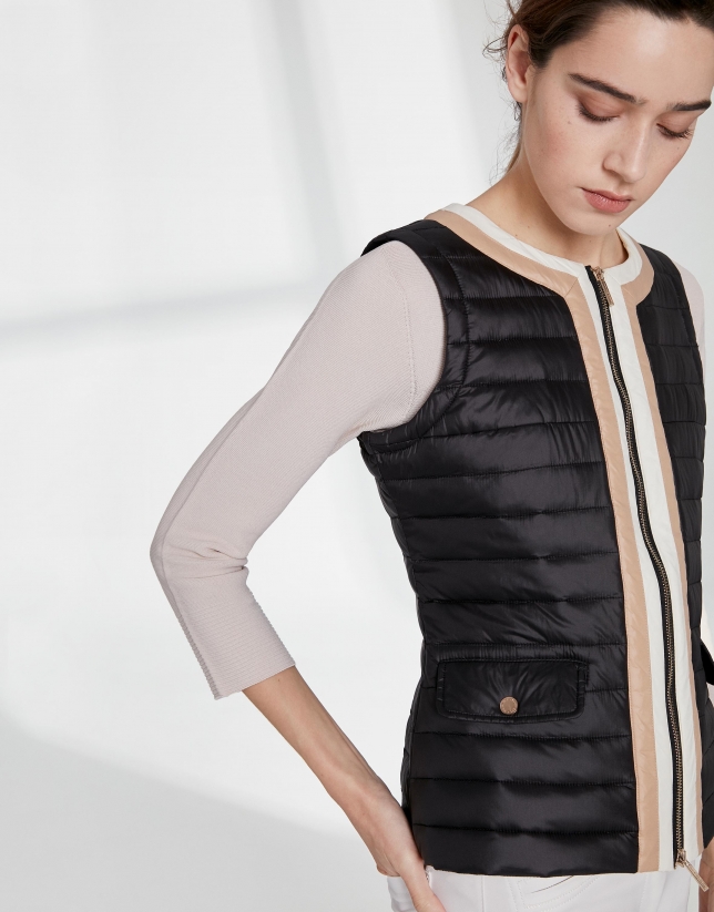 Black quilted vest with contrasting beige
