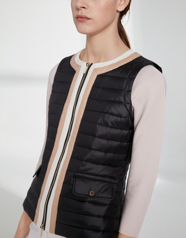 Black quilted vest with contrasting beige