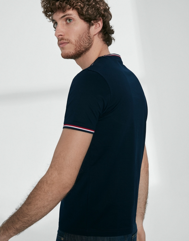 Navy blue top with red ribbed collar