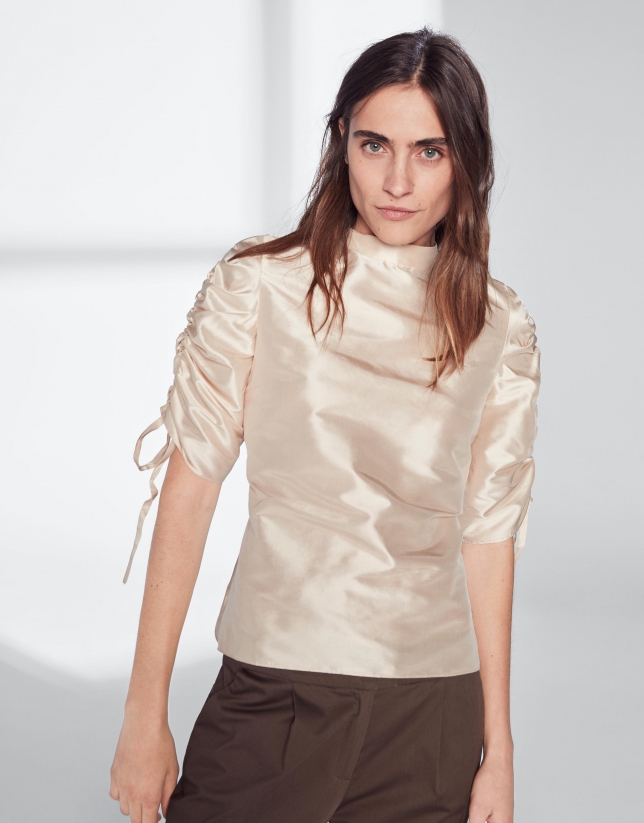 Beige silk blouse with puckered sleeves