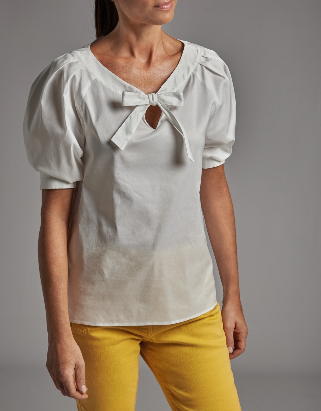 White shirt with boat neck and bow